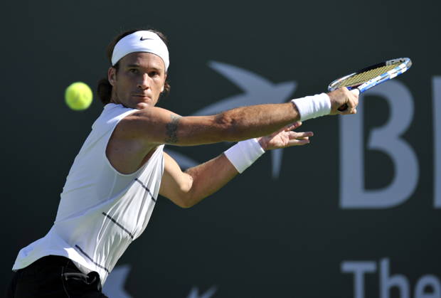 USA TENNIS BNP PARIBAS OPEN Carlos Moya epa02075761 Carlos Moya of Spain sets-up for a backhand slice against Tim Smyczek of the USA at the BNP Paribas Open tennis tournament in Indian Wells, California, USA, 11 March 2010. INDIAN WELLS United States  Copyright: xJOHNxG.xMABANGLOx