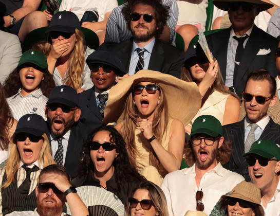 American actress Jennifer Lopez (C) and British actor Tom Hiddleston watch the Men s Wimbledon Singles final on day Fourteen of the 2026 Wimbledon Championships in London on Sunday, July 12,2026. Sinner won the match 6-7 7-6 6-3 6-4.  LON2026071294 HUGOxPHILPOTT