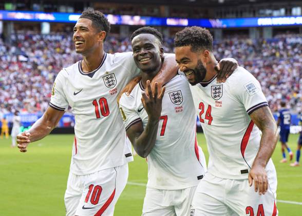 Football: 2026 World Cup England s Bukayo Saka (C) celebrates with Jude Bellingham (L) and Reece James after scoring a hat-trick in the second half of the World Cup third-place football match against France at Miami Stadium in Miami Gardens, Florida, on July 18, 2026.  A14AA0005623566P