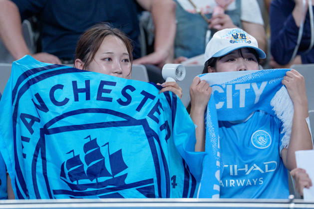 2026 2026 Coupang Play Series football match ( Team K League vs Manchester City FC - 2026 08 05 ) SEOUL, SOUTH KOREA, AUGUST 05: Two Manchester City fans hold up a team banner during the 2026 Coupang Play Series football match match between Team K League and Manchester City FC at the Seoul World Cup Stadium in Seoul, South Korea, on August 05, 2026. Seoul Seoul World Cup Stadium South Korea 8284_287522 Copyright: xStevexChoxKyewoong PentaxPressx
