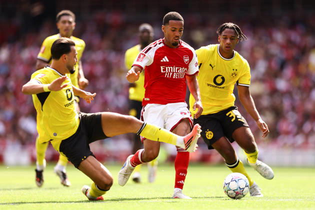 Arsenal v Borussia Dortmund 09 August 2026, London - Emirates Cup - Arsenal v Borussia Dortmund - Ramy Bensebaini of Borussia Dortmund tackles Ethan Nwaneri of Arsenal - Photo: Jacques Feeney Offside. London UK Copyright: xJacquesxFeeneyx xOffsidexOffside