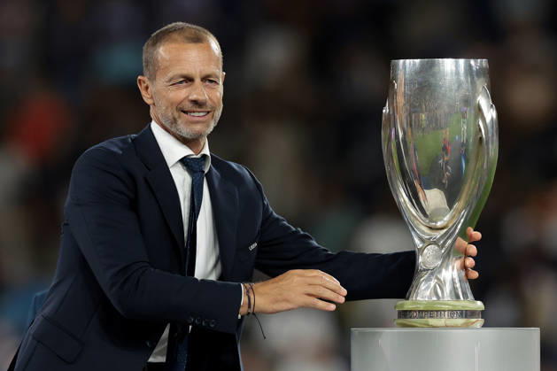 Paris Saint Germain v Aston Villa - UEFA Super Cup - Stadion Salzburg Salzburg, Austria, 12th August 2026. UEFA President Aleksander Ceferin reaches for the UEFA Supercup to present to Marquinhos of PSG following the Paris Saint Germain vs Aston Villa UEFA Super Cup match at Stadion Salzburg, Salzburg. Picture credit should read: Jonathan Moscrop Salzburg Stadion Salzburg Austria