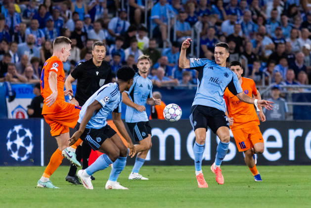 Rahim Ibrahim of SK Slovan Bratislava and Svetozar Markovic of SK Slovan Bratislava seen during UEFA Champions league first play-off game between teams of SK Slovan Bratislava and Celje (Dominika Kortvelyesiova Ball Raw Images) Bratislava Tehelne Pole stadium Slovakia Copyright: xDominikaxKortvelyesiovax DKOR2025