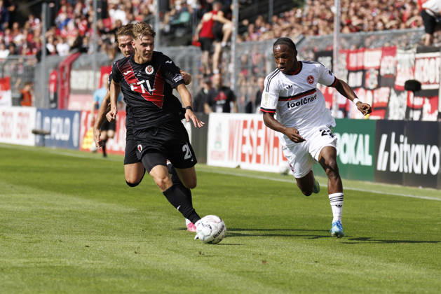 KOELN, GERMANY - AUGUST 22, 2026: Mohamed Alì Zoma (1. FC Nuernberg, 23), Niklas Swider (Viktoria Koeln, 20) during the DFB-Cup match between Viktoria Koeln vs. 1. FC Nuernberg at the Sportpark Hoehenberg on August 22, 2026 in Koeln, Germany. DFL REGULATIONS PROHIBIT ANY USE OF PHOTOGRAPHS AS IMAGE SEQUENCES AND OR QUASI-VIDEO. Nordrhein-Westfalen Germany Copyright: xAxelxKohringx