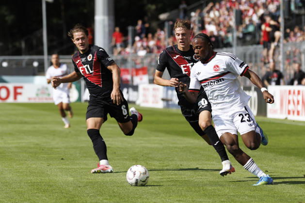 KOELN, GERMANY - AUGUST 22, 2026: Tobias Eisenhuth (Viktoria Koeln, 6), Niklas Swider (Viktoria Koeln, 20), Mohamed Alì Zoma (1. FC Nuernberg, 23)during the DFB-Cup match between Viktoria Koeln vs. 1. FC Nuernberg at the Sportpark Hoehenberg on August 22, 2026 in Koeln, Germany. DFL REGULATIONS PROHIBIT ANY USE OF PHOTOGRAPHS AS IMAGE SEQUENCES AND OR QUASI-VIDEO. Nordrhein-Westfalen Germany Copyright: xAxelxKohringx