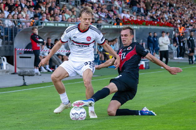 Zweikampf zwischen Tim Janisch (1. FC Nuernberg, 32) und Kilian Jakob (Viktoria Koeln, 26). Viktoria Koeln vs. 1. FC Nuernberg, Fussball, DFB-Pokal, 1. Runde, Saison 2026 2027, 22.08.2026 DFL DFB Regulations prohibit any use of Photographs as image sequences and or Quasivideo Viktoria Koeln vs. 1. FC Nuernberg, Fussball, DFB-Pokal, 1. Runde, Saison 2026 2027, 22.08.2026 Koeln Copyright: xEibner-Pressefoto ThomasxHaeslerx EP_THR