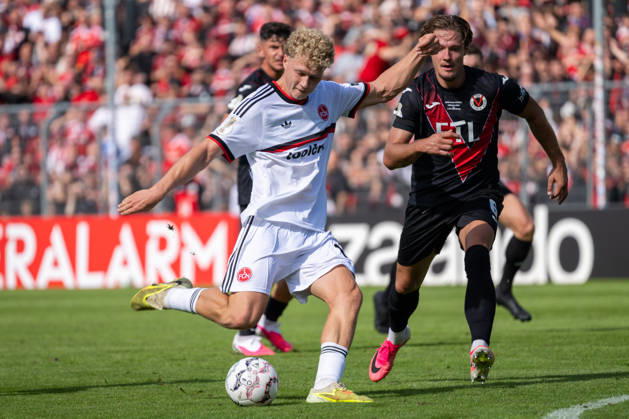 Tobias Eisenhut (Viktoria Koeln, 06) kommt beim Schuss von Piet Scobel (1. FC Nuernberg, 19) zu spaet. Viktoria Koeln vs. 1. FC Nuernberg, Fussball, DFB-Pokal, 1. Runde, Saison 2026 2027, 22.08.2026 DFL DFB Regulations prohibit any use of Photographs as image sequences and or Quasivideo Viktoria Koeln vs. 1. FC Nuernberg, Fussball, DFB-Pokal, 1. Runde, Saison 2026 2027, 22.08.2026 Koeln Copyright: xEibner-Pressefoto ThomasxHaeslerx EP_THR
