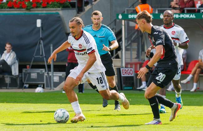 22.08.2026 - Fussball - Saison 2026 2027 - DFB Pokal Vereinspokal - 01. Runde: Viktoria Köln - 1. FC Nürnberg Nuernberg FCN ( Club ) - Sportfoto Zink DaMa - xdaxmax - regulations prohibit any use of photographs as image sequences and or quasi-video - Rafael Lubach (18, 1. FC Nürnberg FCN ) Niklas Swider (20, FC Viktoria Köln )