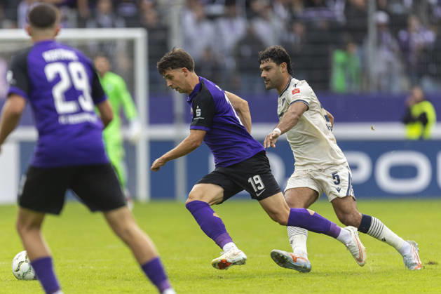 GER, Aue, Fussball, DFB-Pokal, 1. Hauptrunde, FC Erzgebirge Aue vs. TSG 1899 Hoffenheim im Bild v.l.: Christoph Pauling (FC Erzgebirge Aue 19), Ozan Kabak (TSG Hoffenheim 05), Zweikampf 22.08.2026, EINS Erzgebirgsstadion Aue DFB REGULATIONS PROHIBIT ANY USE OF PHOTOGRAPHS AS IMAGE SEQUENCES AND OR QUASI-VIDEO, Copyright: HMBxMedia PaulxFritz