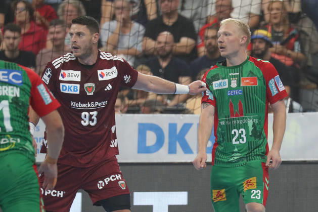 22.08.2026, xgox, Handball, Rexel Supercup 2026, SC Magdeburg - Füchse Berlin, v.l. Mijajlo Marsenic (Berlin, 93), Magnus Saugstrup (Magdeburg, 23) Zweikampf, Duell, Kampf, tackle München