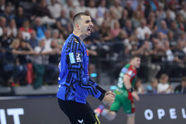 22.08.2026, xgox, Handball, Rexel Supercup 2026, SC Magdeburg - Füchse Berlin, v.l. Matej Mandic (Magdeburg, 12) Jubelt ueber gehaltenen Ball, abgewehrt, gehalten, Torhueter München