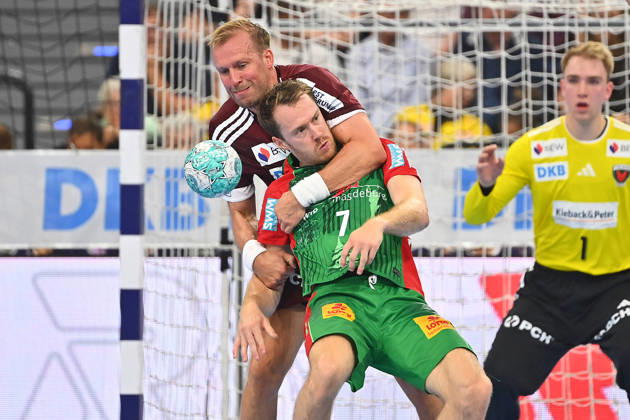 Max DAJ (Fuechse Berlin), Aktion,Zweikampf gegen Felix CLAAR (SC Magdeburg). hi:Torwart Lasse LUDWIG (Fuechse Berlin). Handball Rexel Super Cup 2026 der Maenner SC Magdeburg vs. Fuechse Berlin am 22.08.2026 SAP GARDEN Muenchen.