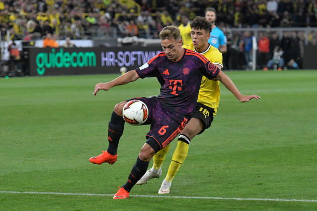 v. li. im Zweikampf Joshua Kimmich (Bayern 6) Samuele Inacio (Dortmund 40) 22.08.2026 ¢ Fussball ¢ Borussia Dortmund vs FC Bayern München ¢ Super Cup, Signal Iduna Park, Dortmund, DFB DFL REGULATIONS PROHIBIT ANY USE OF PHOTOGRAPHS AS IMAGE SEQUENCES AND OR QUASI-VIDEO NRW Germany