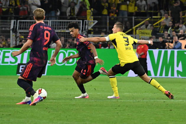22.08.2026, xsltx, Fussball Franz Beckenbauer Supercup 2026, Borussia Dortmund - FC Bayern München v.l. Nathaniel Brown (FC Bayern Muenchen) Waldemar Anton (Borussia Dortmund) Zweikampf, Aktion, action, battle for the ball (DFL DFB REGULATIONS PROHIBIT ANY USE OF PHOTOGRAPHS as IMAGE SEQUENCES and or QUASI-VIDEO) Dortmund