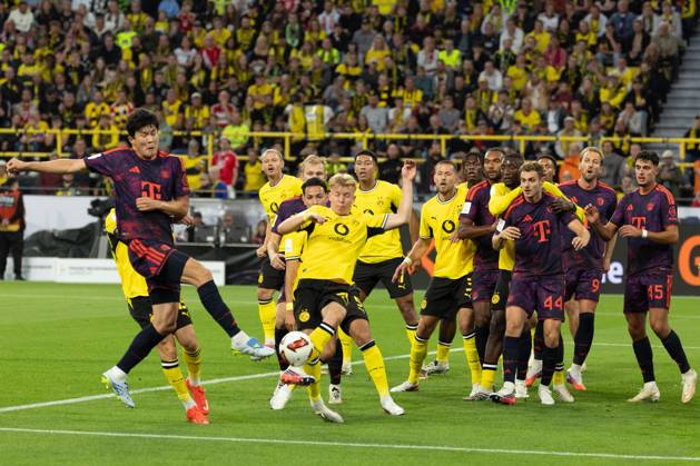 (260823) -- DORTMUND, Aug. 23, 2026 -- Kim Minjae (1st L) of FC Bayern Munich shoots during the Franz Beckenbauer Supercup 2026 football match between FC Bayern Munich and Borussia Dortmund in Dortmund, Germany, Aug. 22, 2026. (Photo by Xinhua) (SP)GERMANY-DORTMUND-FOOTBALL-SUPERCUP-MUNICH VS DORTMUND JoachimxBywaletz 