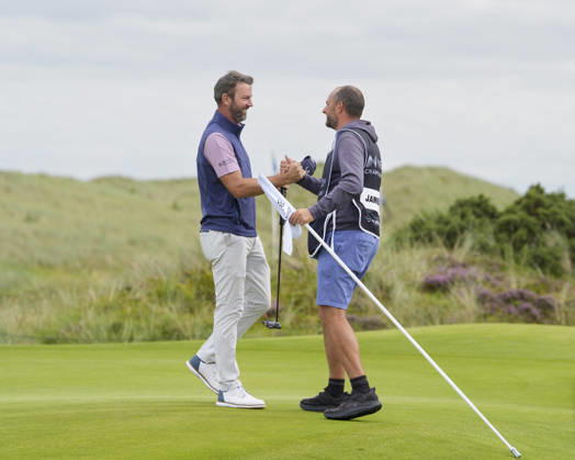 BALMEDIE, SCOTLAND - AUG 23: Scott Jamieson (SCO) celebrates with his caddie after winning the 2026 Nexo Championship at the Trump International Golf Links, Balmedie on August 23, 2026 in Aberdeenshire, Scotland The 2026 Nexo Championship