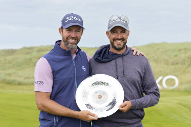 BALMEDIE, SCOTLAND - AUG 23: Scott Jamieson (SCO) holds the Nexo Trophy with his caddie after Round 4 at the 2026 Nexo Championship at the Trump International Golf Links, Balmedie on August 23, 2026 in Aberdeenshire, Scotland The 2026 Nexo Championship