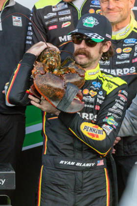 LOUDON, NH - AUGUST 23: Ryan Blaney ( 12 Team Penske Menards Dutch Boy Ford) puts the lobster on his shoulder after winning the NASCAR, Motorsport, USA Cup Series Dollar Tree 301 on August 23, 2026, at New Hampshire Motor Speedway in Loudon, NH. (Photo by David Hahn Icon Sportswire) AUTO: AUG 23 NASCAR Cup Series Dollar Tree 301 EDITORIAL USE ONLY Icon260823025