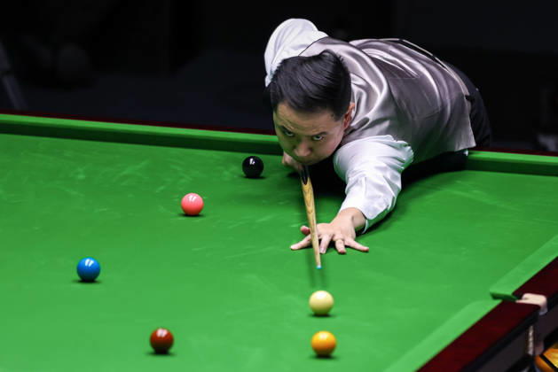 WUHAN, CHINA - AUGUST 23: Xiao Guodong of Chin plays a shot in the first round match against Wang Xinbo of China on day 1 of Wuhan Open 2026 at the Optics Valley Gymnasium of Huazhong University of Science and Technology on August 23, 2026 in Wuhan, Hubei Province of China. Copyright: xChinaxNewsxServicex 111661687433