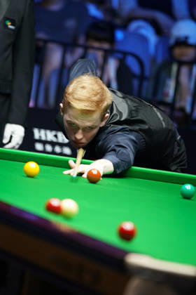 WUHAN, CHINA - AUGUST 24: Artemijs Zizins of Latvia plays a shot in the second round match against Wu Yize of China on day 2 of Wuhan Open 2026 at the Optics Valley Gymnasium of Huazhong University of Science and Technology on August 24, 2026 in Wuhan, Hubei Province of China.  Copyright: xTaixChengzhex 111661853310