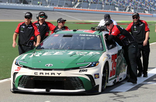 DAYTONA BEACH, FL - AUGUST 28: Riley Herbst ( 35 23XI Racing TREETOP Toyota) is pushed down pit road before qualifying for the NASCAR, Motorsport, USA Cup Series Coke Zero Sugar 400 on August 28, 2026 at Daytona International Speedway in Daytona Beach, FL. (Photo by Michael Bush Icon Sportswire) AUTO: AUG 28 NASCAR Cup Series Coke Zero Sugar 400 EDITORIAL USE ONLY Icon260828017400