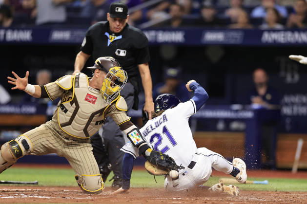 August 28, 2026, St. Petersburg, Florida, USA: Tampa Bay Rays right fielder Jonny DeLuca (21) slides safely at home on a sacrifice fly by second baseman Jorge Mateo (9) before San Diego Padres catcher Freddy Fermin (54) can tag during an MLB, Baseball Herren, USA game on August 28, 2026 at Tropicana Field. The Rays beat the Padres 9-4. St. Petersburg USA - ZUMAh180 20260828_zsp_h180_082 Copyright: xKimxHukarix