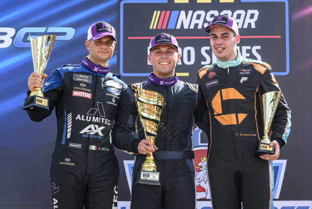 NASCAR, Motorsport, USA Euro Series, category EuroNASCAR V8GP, took place in Most, Czech Republic, on August 29, 2026. From left: Gianmarco Ercoli from Italy of the ALUMITEC Racing team, who finished second, winner Jordan O Brien from the USA of the Hendriks Motorsports team and Thomas Krasonis from Greece of the PK Carsport team. (CTKxPhoto OndrejxHajek) CTKPhotoP2026082904054  CTKPhotoP2026082904054