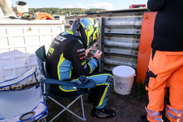 NASCAR, Motorsport, USA Euro Series, category EuroNASCAR Open, took place in Most, Czech Republic, on August 29, 2026. Martin Doubek from the Czech Republic of the Hendriks Motorsports team. Martin Doubek from the Czech Republic, of the Hendriks Motorsports team, looks at the footage of his accident behind the barriers. (CTKxPhoto OndrejxHajek) CTKPhotoP2026082904902  CTKPhotoP2026082904902