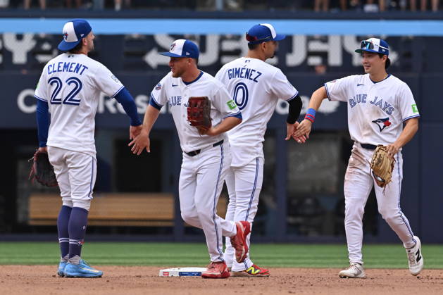 August 29, 2026, Toronto, On, Canada: Toronto Blue Jays, from left, Ernie Cement, Myles Straw, Andres Gimenez and Brett Bateman celebrate after their team defeated the Seattle Mariners in MLB, Baseball Herren, USA baseball action in Toronto on Saturday, Aug. 29, 2026. Canada News - August 29, 2026 - ZUMAc35_ 20260829_zaf_c35_144 Copyright: xJonxBlackerx