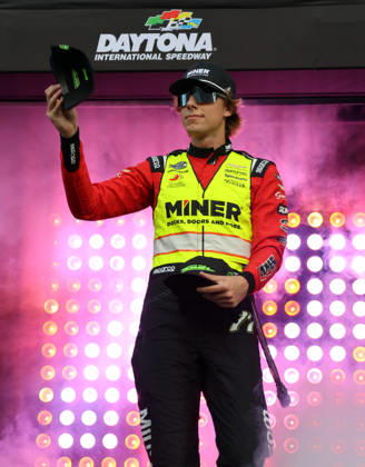 DAYTONA BEACH, FL - AUGUST 29: Carson Hocevar ( 77 Spire Motorsports Miner Docks, Doors and More Chevrolet) tosses hats to the crowd during driver introduction prior to the NASCAR, Motorsport, USA Cup Series Coke Zero Sugar 400 on August 29, 2026 at Daytona International Speedway in Daytona Beach, FL. (Photo by Michael Bush Icon Sportswire) AUTO: AUG 29 NASCAR Cup Series Coke Zero Sugar 400 EDITORIAL USE ONLY Icon260829022