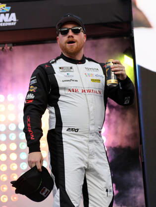 DAYTONA BEACH, FL - AUGUST 29: Tyler Reddick ( 45 23XI Racing Jordan Brand Toyota) tosses hats to the crowd during driver introduction prior to the NASCAR, Motorsport, USA Cup Series Coke Zero Sugar 400 on August 29, 2026 at Daytona International Speedway in Daytona Beach, FL. (Photo by Michael Bush Icon Sportswire) AUTO: AUG 29 NASCAR Cup Series Coke Zero Sugar 400 EDITORIAL USE ONLY Icon260829029