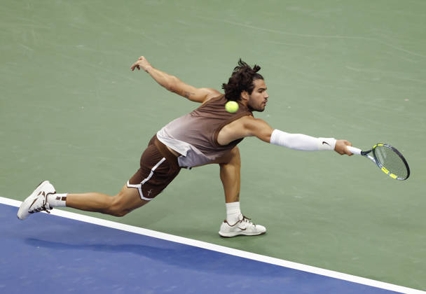 Carlos Alcaraz of Spain reaches to return a ball to Roman Safiullin in Arthur Ashe Stadium at the 2026 US Open Tennis Championship at the USTA Billie Jean King National Tennis Center in New York City on Monday, August 31, 2026. Alcaraz defeated Safiullin in straight sets to advance to the second round.  NYP20260831109 JOHNxANGELILLO