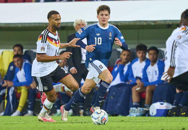 Josha Vagnoman of Germany compete for the ball, tackling, duel, header, zweikampf, action, fight against Christos Tzolis of Greece in the UEFA Nations League 2026 group stage match GERMANY - GREECE 0-1 in Season 2026 2027 at September 27, 2026 in Augsburg, Germany.