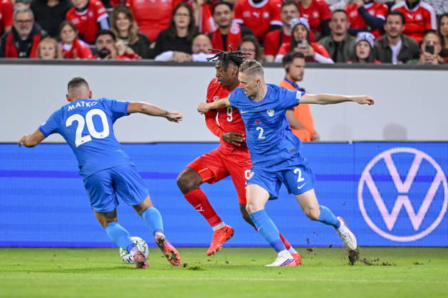 Aljosa Matko (Slovenia), Johan Manzambi (Switzerland) and Zan Karnicnik (Slovenia) battle for the ball during the UEFA Nations League 2026 27 group phase match between Switzerland and Slovenia at Luzern Arena on October 3, 2026 in Lucerne, Switzerland. (Photo by Harry Langer DeFodi Images) -