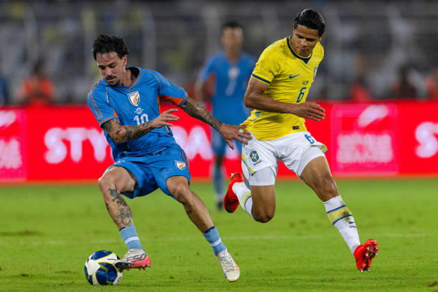 KOLKATA, INDIA - OCTOBER 3: Ryan Williams of India and Douglas dos Santos Justino de Melo of Brazil duel for the ball during friendly match between India and Brazil at the Vivekananda Yuba Bharati Krirangan (VYBK) Stadium in Kolkata, India on 3rd October, 2026 Copyright: xUnnatixNaidux Sportspressphoto_SPR245137