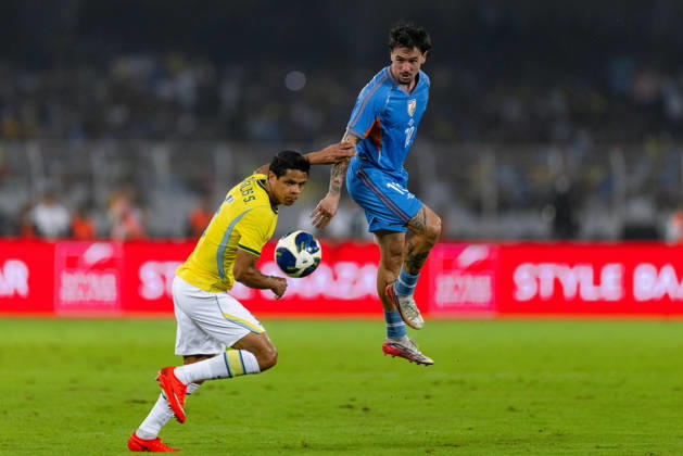 KOLKATA, INDIA - OCTOBER 3: Ryan Williams of India and Douglas dos Santos Justino de Melo of Brazil duel for the ball during friendly match between India and Brazil at the Vivekananda Yuba Bharati Krirangan (VYBK) Stadium in Kolkata, India on 3rd October, 2026 Copyright: xUnnatixNaidux Sportspressphoto_SPR245138