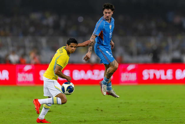 KOLKATA, INDIA - OCTOBER 3: Ryan Williams of India and Douglas dos Santos Justino de Melo of Brazil duel for the ball during friendly match between India and Brazil at the Vivekananda Yuba Bharati Krirangan (VYBK) Stadium in Kolkata, India on 3rd October, 2026 Copyright: xUnnatixNaidux Sportspressphoto_SPR245139