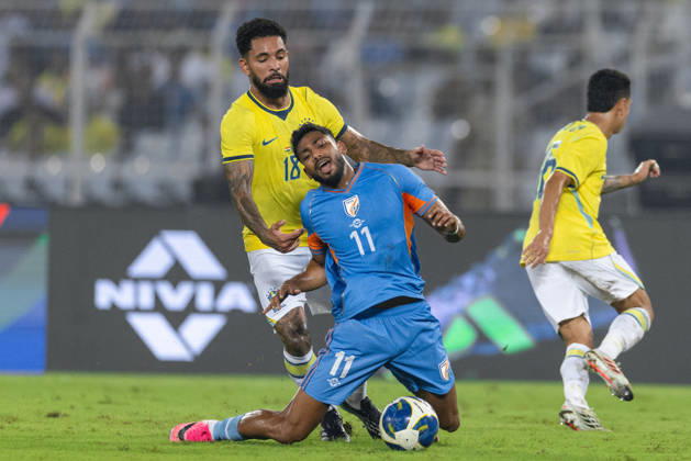 KOLKATA, INDIA - OCTOBER 3: Douglas Luiz Soares de Paulo of Brazil and Rahim Ali of India duel for the ball during friendly match between India and Brazil at the Vivekananda Yuba Bharati Krirangan (VYBK) Stadium in Kolkata, India on 3rd October, 2026 Copyright: xUnnatixNaidux Sportspressphoto_SPR245239