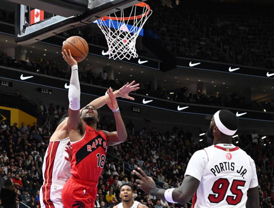 October 3, 2026, Quebec, On, Canada: Toronto Raptors Malachi Smith shoots while Miami Heat s Simone Fontecchio, back left, defends and Bobby Portis Jr. looks on during NBA, Basketball Herren, USA preseason basketball action in Quebec City, Saturday, Oct. 3, 2026. Canada News - October 3, 2026  - ZUMAc35_ 20261003_zaf_c35_123 Copyright: xJacquesxBoissinotx