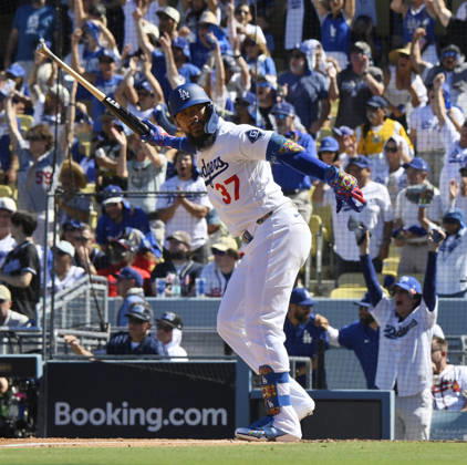 Los Angeles Dodgers Teoscar Hernandez celebrates after hitting a 2-run home run in the fourth inning off Atlanta Braves reliever Victor Mederos in game one of the National League Division Series at Dodger Stadium on Saturday, October 3, 2026 in Los Angeles, California.  LAP20261003803 JIMxRUYMEN