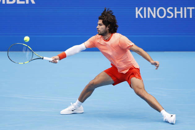 October 4, 2026, Tokyo, Japan: Carlos Alcaraz (Spain) returns a shot against Denis Shapovalov (Canada) during their quarterfinal match at the Kinoshita Group Japan Open Tennis Championships at Ariake Colosseum in Tokyo. Shapovalov suffered an injury, forcing him to retire early in the second set. The tournament runs from September 29 to October 6. Alcaraz won 7-6(3), 2-1 Tokyo Japan - ZUMAm191 20261004_aap_m191_052 Copyright: xRodrigoxReyesxMarinx