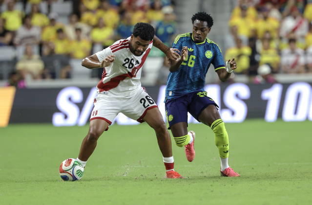 International soccer friendly - Colombia vs. Peru Peru midfielder Piero Magallanes (L) in action against Colombia forward Carlos Andres Gomez (R) during the international soccer friendly between Colombia and Peru at Nu Stadium in Miami, Florida, USA, 06 October 2026. MIAMI FLORIDA United States Copyright: xCRISTOBALxHERRERA-ULASHKEVICHx