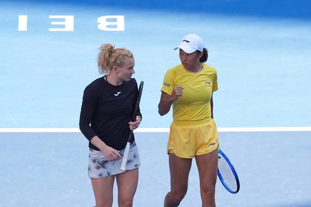 (261007) -- BEIJING, Oct. 7, 2026 -- Katerina Siniakova Zhang Shuai (R) celebrate during the women s doubles round of 16 match between Katerina Siniakova(the Cezch Republic) Zhang Shuai(China) and Nikola Bartunkova(the Cezch Republic) Maja Chwalinska(Poland) at 2026 China Open tennis tournament in Beijing, China, Oct. 7, 2026. ) (SP)CHINA-BEIJING-TENNIS-CHINA OPEN-WOMEN S DOUBLES (CN) JuxHuanzong 