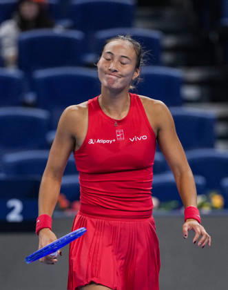 (261007) -- BEIJING, Oct. 7, 2026 -- Zheng Qinwen reacts during the women s singles fourth round match between Zheng Qinwen of China and Alina Charaeva of Armenia at 2026 China Open tennis tournament in Beijing, China, Oct. 7, 2026. ) (SP)CHINA-BEIJING-TENNIS-CHINA OPEN-WOMEN S SINGLES (CN) SunxFei 