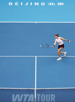 (261008) -- BEIJING, Oct. 8, 2026 -- Karolina Muchova of the Czech Republic hits a return during the women s singles quarterfinal match between Karolina Muchova of the Czech Republic and Nikola Bartunkova of the Czech Republic at 2026 China Open tennis tournament in Beijing, China, Oct. 8, 2026. ) (SP)CHINA-BEIJING-TENNIS-CHINA OPEN-WOMEN S SINGLES (CN) ZhangxChenlin