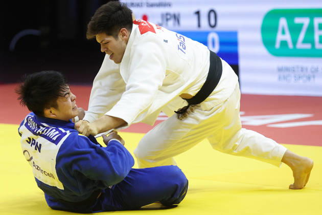 AZERBAIJAN, BAKU - OCTOBER 8, 2026: Sanshiro Murao (top) of Japan and Goki Tajima of Japan compete in their -90 kg bout as part of the 2026 World Judo Championships at the National Gymnastics Arena. Mikhail Sinitsyn TASS  98959054