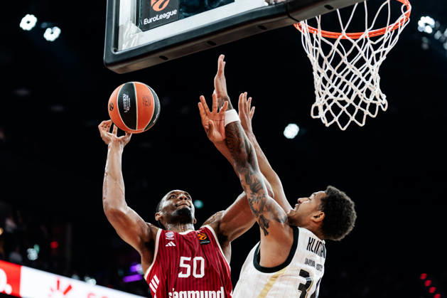 MUNICH, GERMANY - OCTOBER 08: Austin Wiley (FC Bayern Muenchen, 50) shooting the ball against Bo Klintman (Virtus Bologna, 34) during the Turkish Airlines EuroLeague match between FC Bayern Muenchen vs. Virtus Bologna at SAP Garden on round 4 of Turkish Airlines EuroLeague on October 08, 2026 in Munich, Germany. Bavaria Germany Copyright: xSteffiexWunderlx