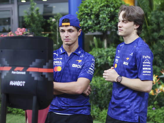 October 8, 2026, Singapore, Kaohsiung City, Singapore: LANDO NORRIS and OSCAR PIASTRI of McLaren Mastercard F1 Team interact with children during a video call in the team s hospitality area in the paddock ahead of the 2026 Formula 1 Singapore Grand Prix at Marina Bay Street Circuit in Singapore. 2026 Singapore Grand Prix  - ZUMAh201 20261008_zsp_h201_035 Copyright: xYichinxHoux