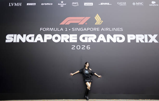 October 8, 2026, Singapore, Kaohsiung City, Singapore: TZUYU (CHOU TZU-YU), Taiwanese member of K-pop girl group TWICE, poses for photographers in front of the Formula 1 Singapore Grand Prix backdrop during her visit to Marina Bay Street Circuit Singapore Singapore - ZUMAh201 20261008_zsp_h201_032 Copyright: xYichinxHoux