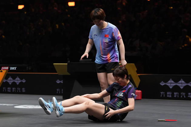 (261010) -- BEIJING, Oct. 10, 2026 -- Wang Manyu(bottom) of China falls down during the women s doubles final match between Wang Manyu Kuai Man of China and Harimoto Miwa Hayata Hina of Japan at 2026 World Table tennis, Tischtennis (WTT) China Smash in Beijing, China, Oct. 10, 2026. ) (SP)CHINA-BEIJING-TABLE TENNIS-WTT-CHINA SMASH-WOMEN S DOUBLES (CN) XiexHan 